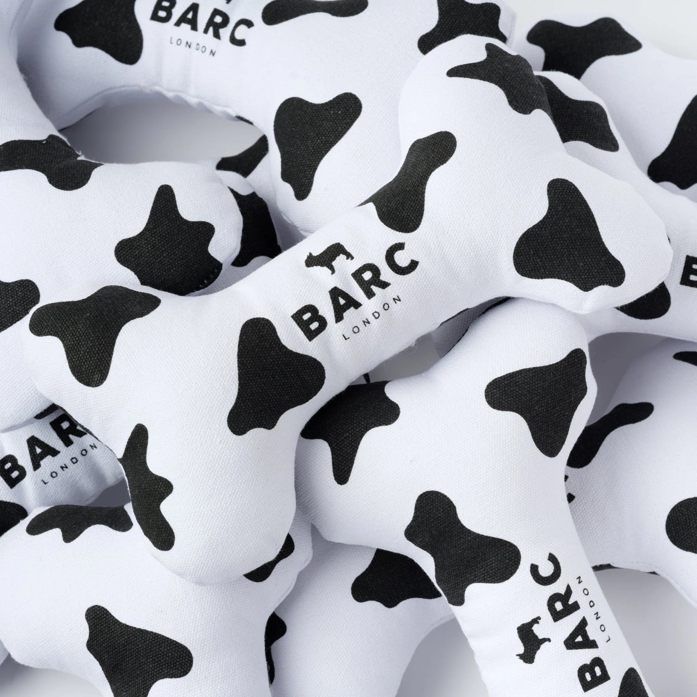 Squeaky Canvas Dog Bone Toy | Cow Print
